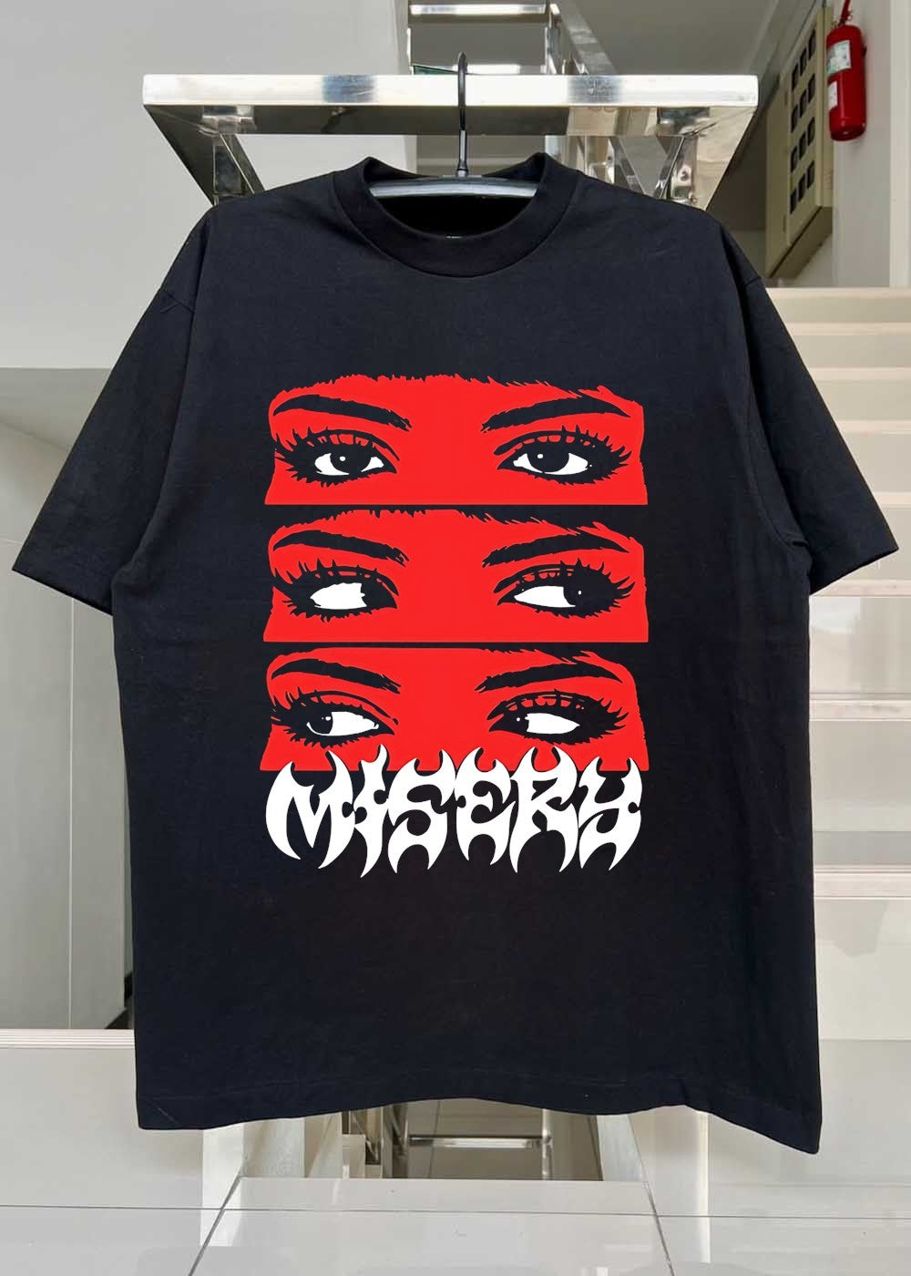 Is A Graphic Department Misery Eyes Glancing Graphic T-Shirt