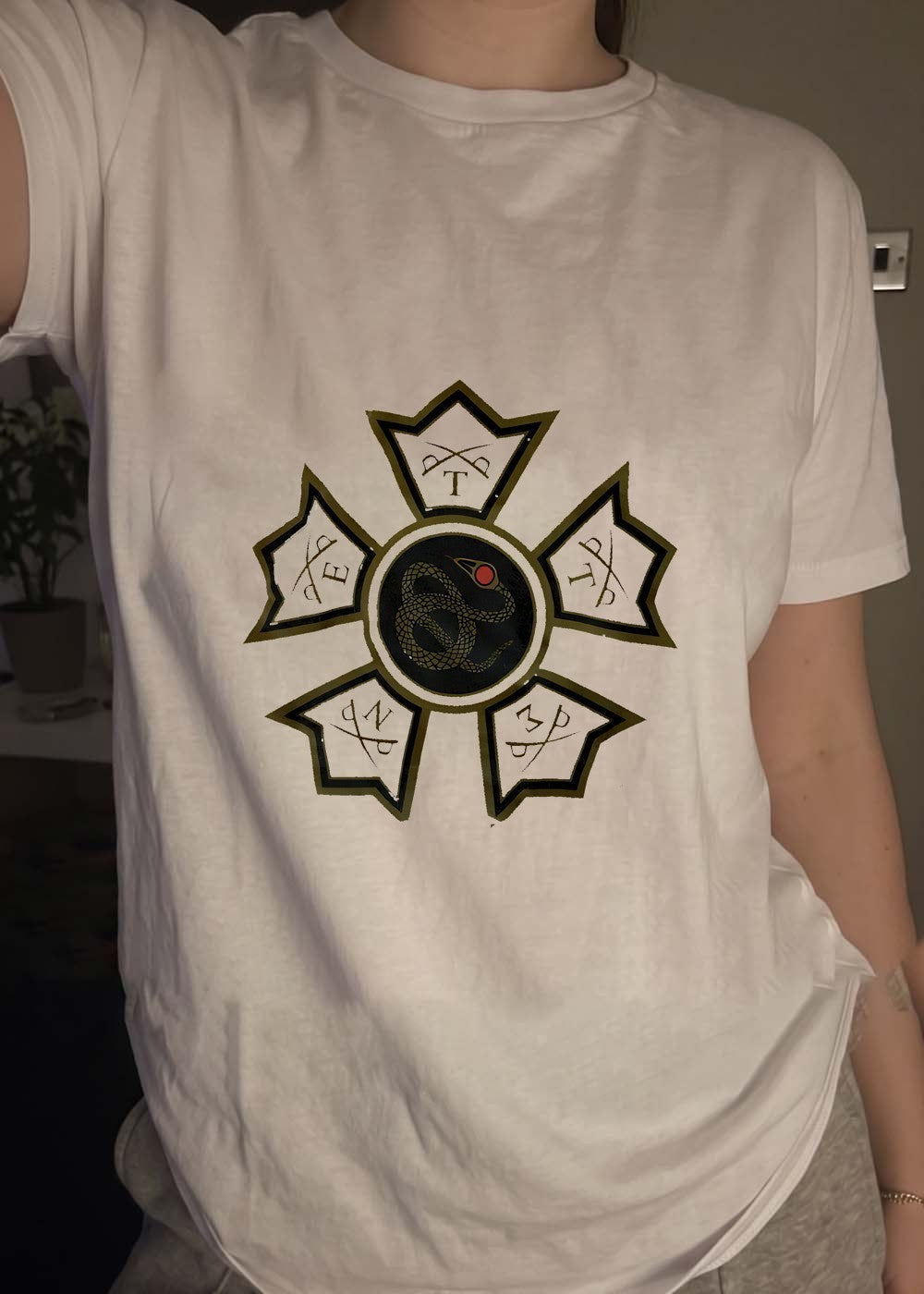 Serpent Emblem Sword T P E P N Z P Logo Graphic T-Shirt