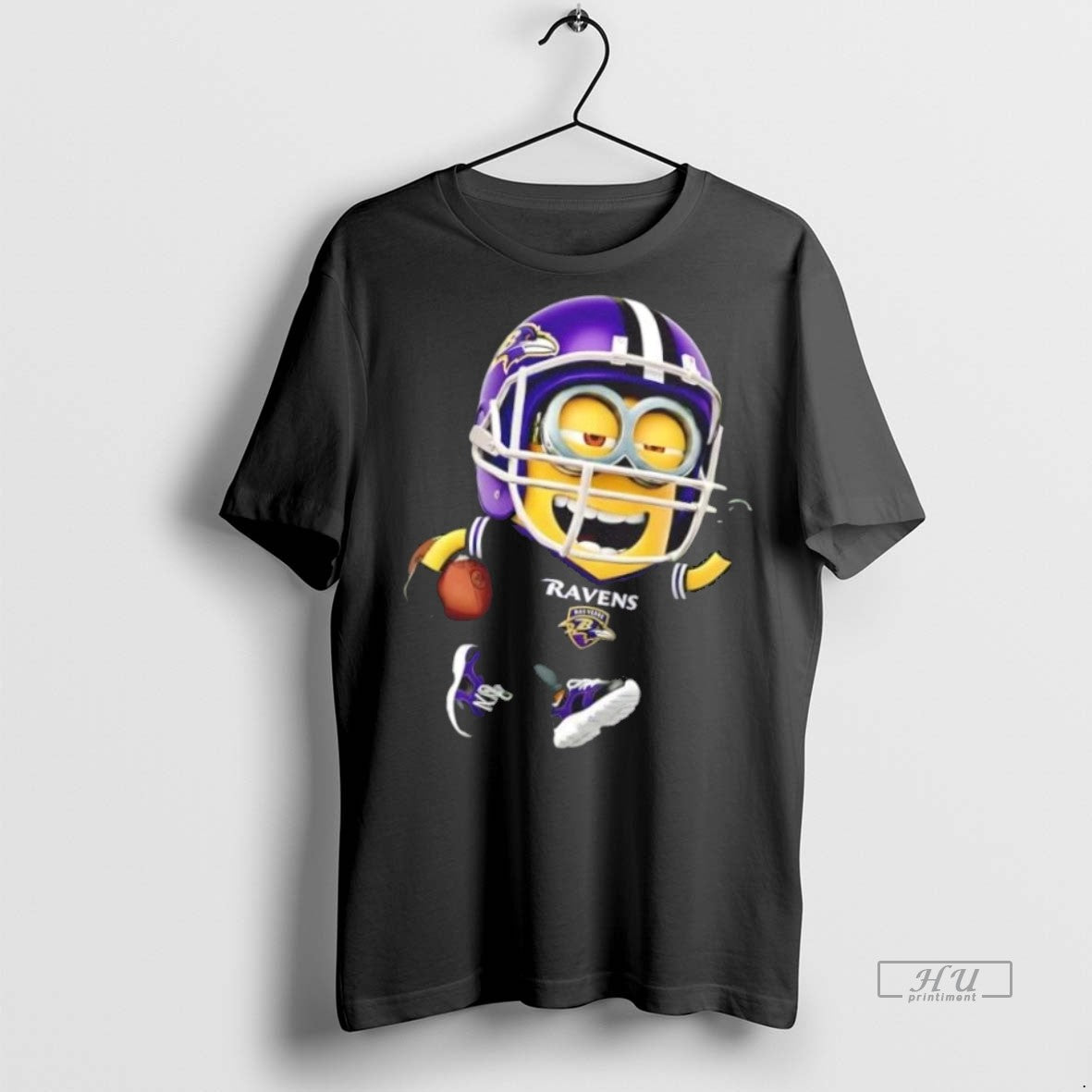 Trending Minions Is Holding A Ball And Smiling At Baltimore Ravens Graphic Tee Shirt Sweater