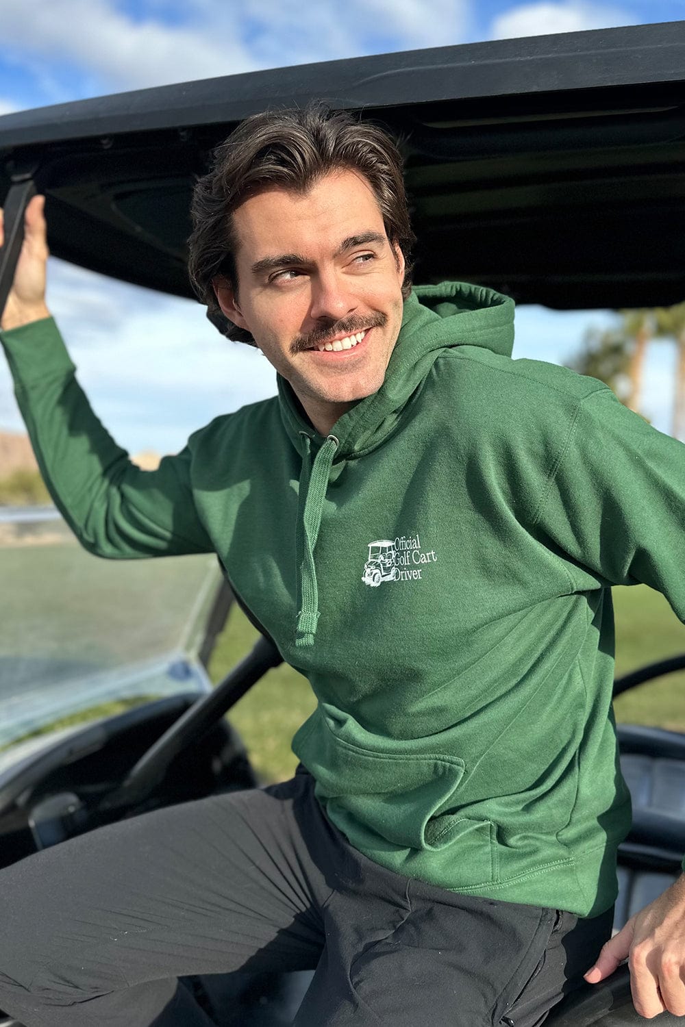 Cass Holland: Official Gold Cart Driver Forrest Green Hoodie