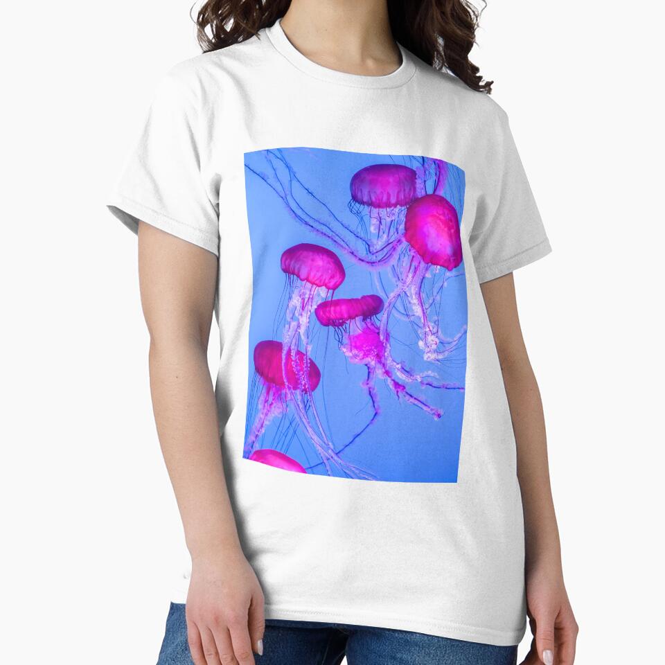 Mesmerizing Pink Jellyfish in Blue Glow by Bentenya