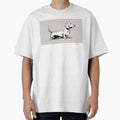 Dachshund stands on a plain surface by anytka