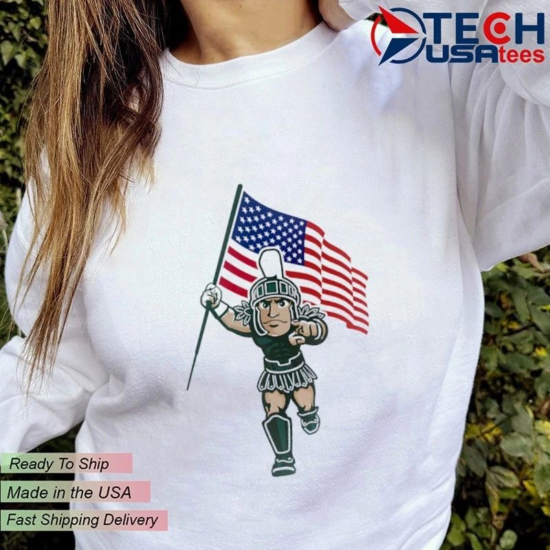 Michigan State Spartans mascot holding USA flag shirt